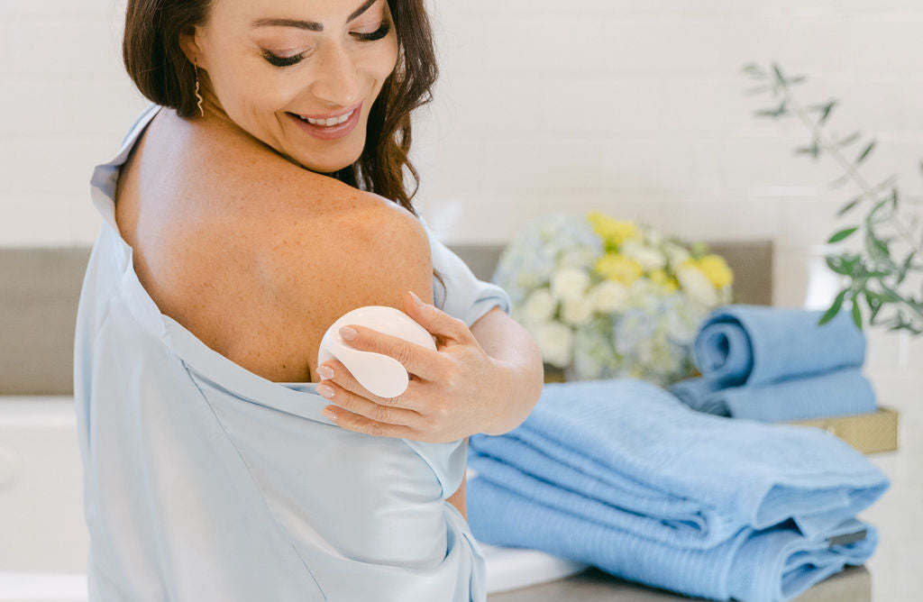 Woman holding a Diamond microdermabrasion tool